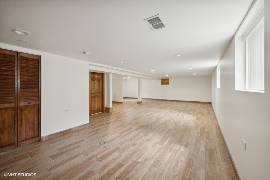 369 Blackhawk Road Riverside, IL 60546 - Photo 23 of 31 wooden floor in an empty room with wooden floor