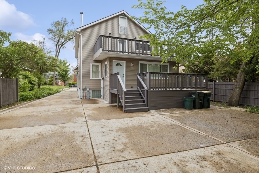 369 Blackhawk Road Riverside, IL 60546 - Photo 25 of 31 a view of a house with a garage and yard