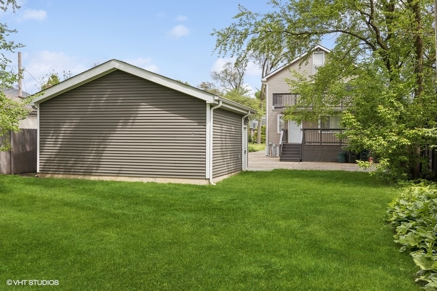 369 Blackhawk Road Riverside, IL 60546 - Photo 27 of 31 a view of a house with a yard