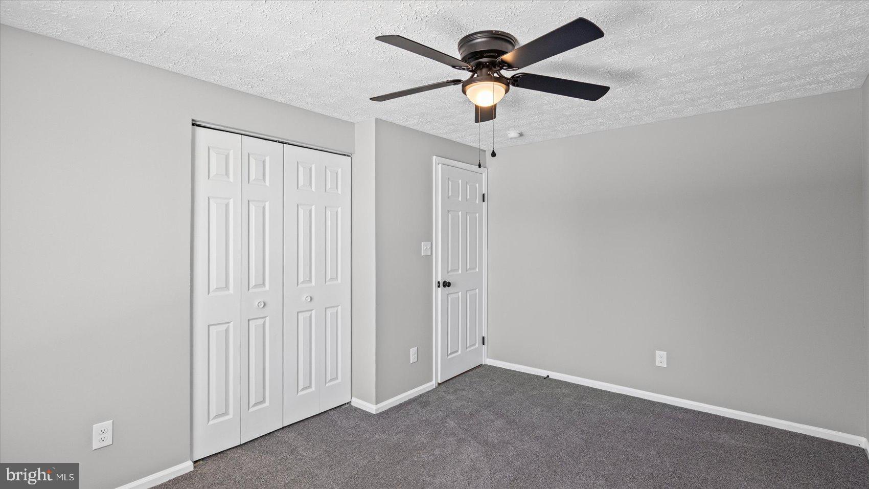 3709 Redberry Way Nottingham, MD 21236 - Photo 23 of 45 an empty room with a ceiling fan and a window