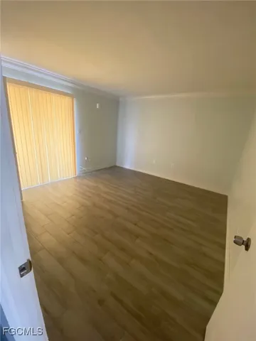 a view of an empty room with a window