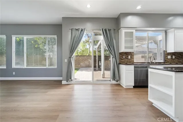a view of a kitchen with a stove top oven