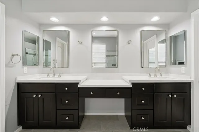 a bathroom with a tub sink and mirror