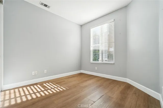 a view of a backyard with table and chairs potted plants with wooden floor
