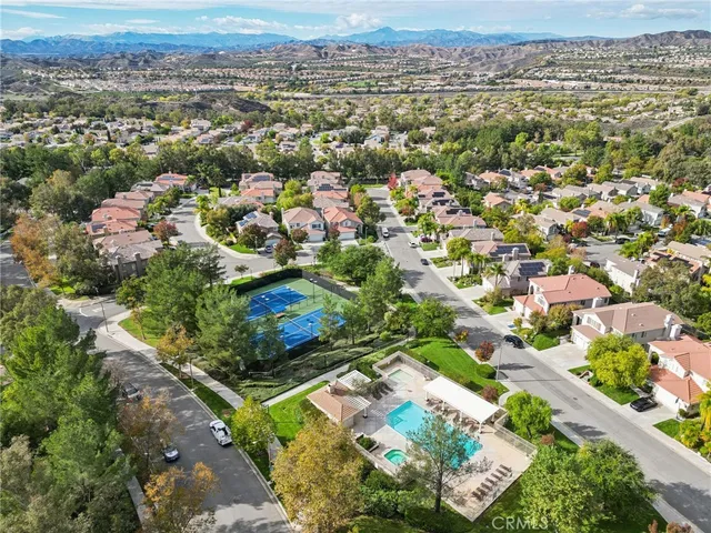 a view of a balcony with wooden floor and outdoor space