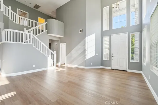 a view of an entryway with wooden floor