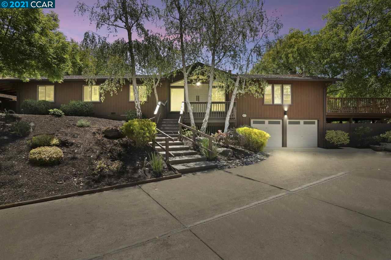 a view of a chairs and table in backyard