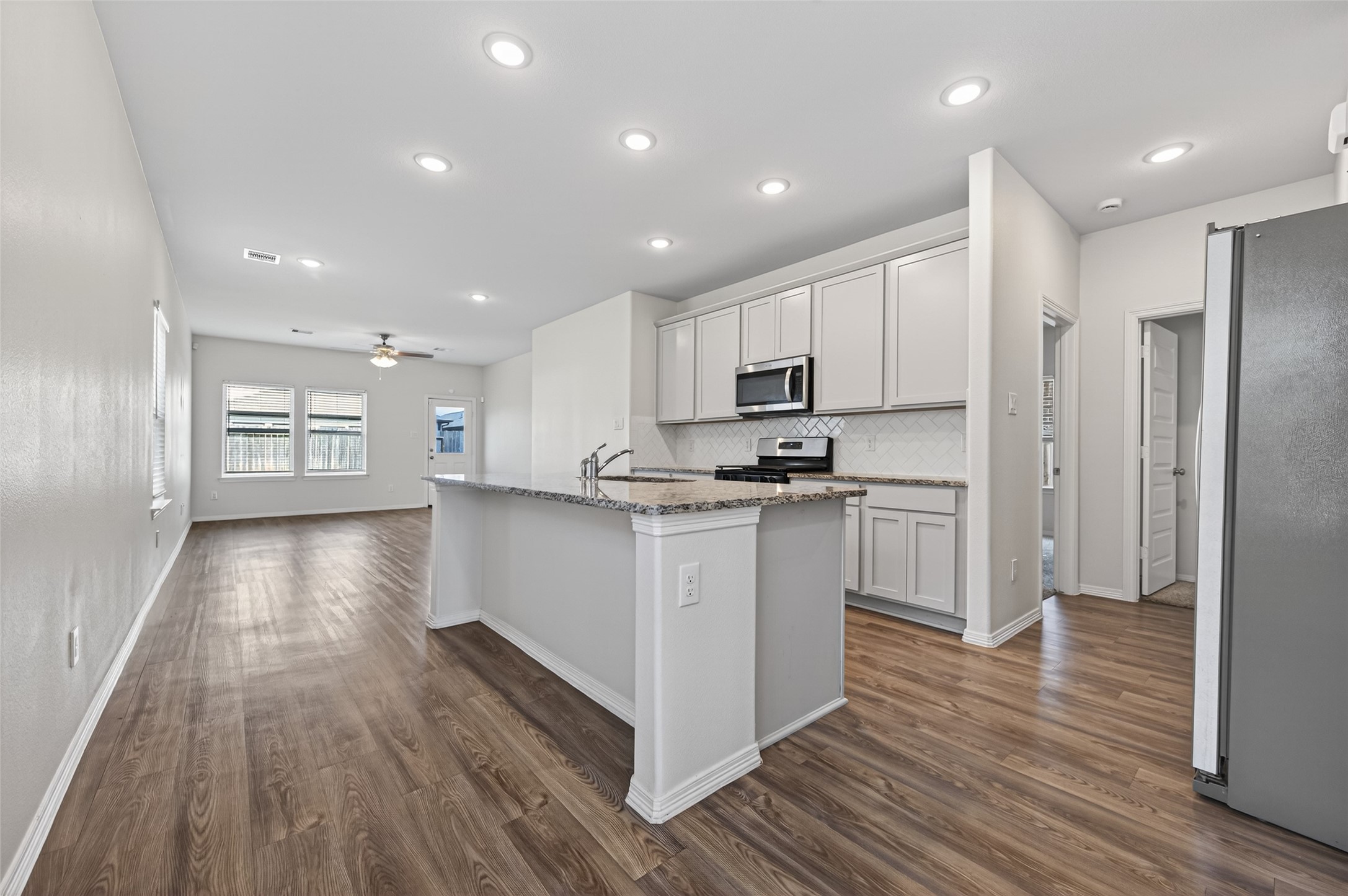 23222 Spring Genesis Lane Katy, TX 77493 - Photo 13 of 43 The open layout encourages easy flow and natural light.