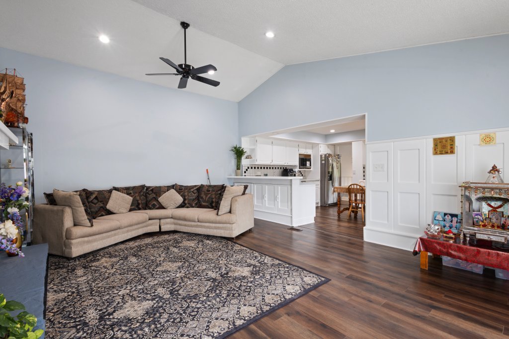 2004 East Parkview Circle Hoffman Estates, IL 60169 - Photo 13 of 36 a living room with furniture and a chandelier