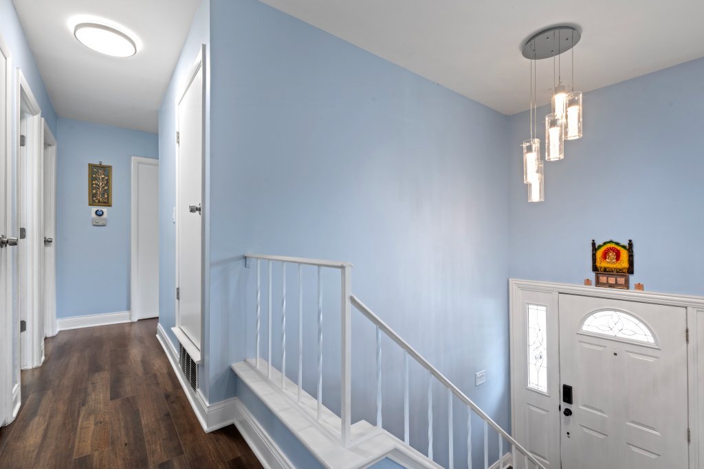 2004 East Parkview Circle Hoffman Estates, IL 60169 - Photo 15 of 36 a view of a hallway with wooden floor and staircase