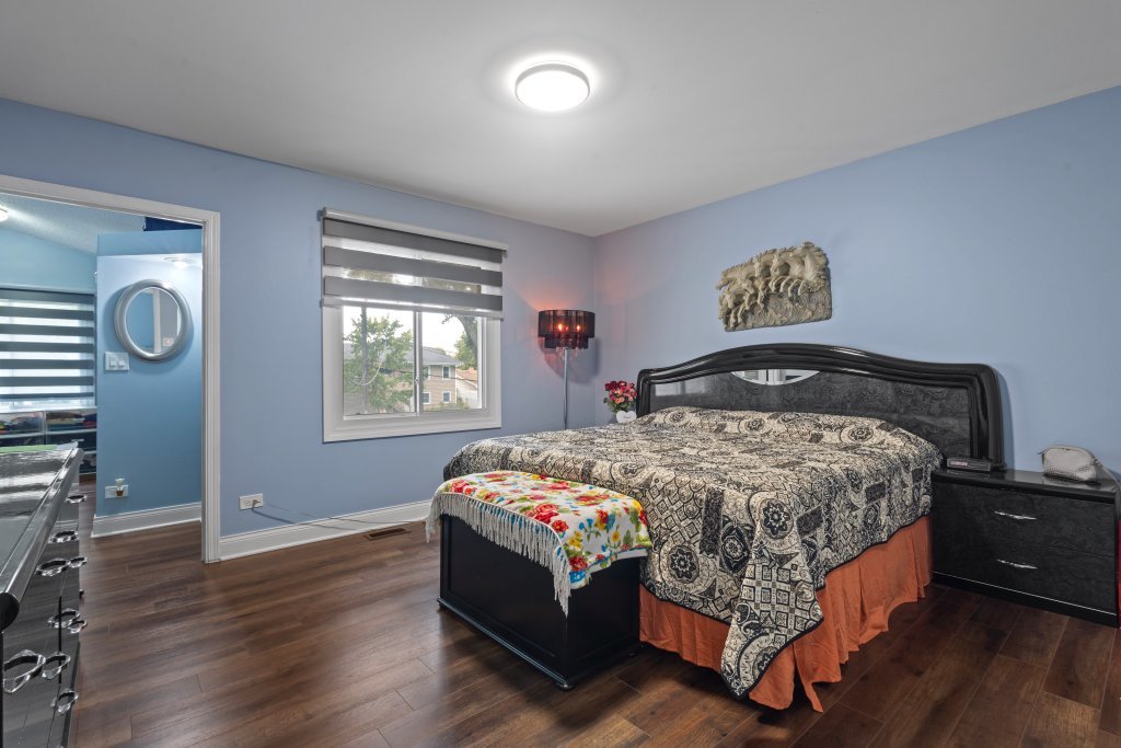 2004 East Parkview Circle Hoffman Estates, IL 60169 - Photo 19 of 36 a bedroom with a bed and window