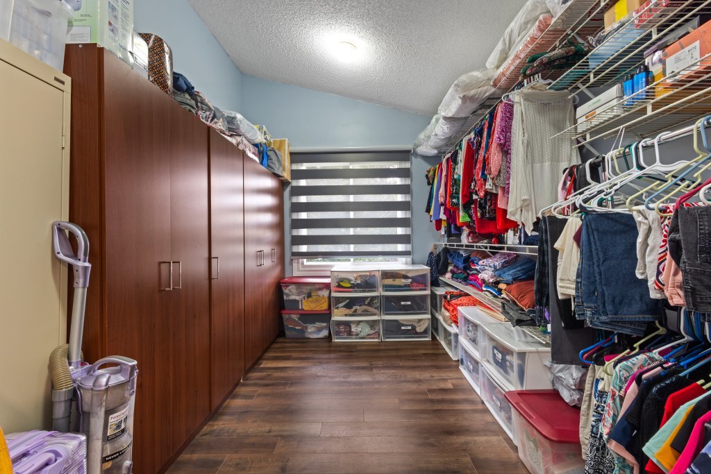 2004 East Parkview Circle Hoffman Estates, IL 60169 - Photo 20 of 36 a view of walk in closet with clothes and shoes