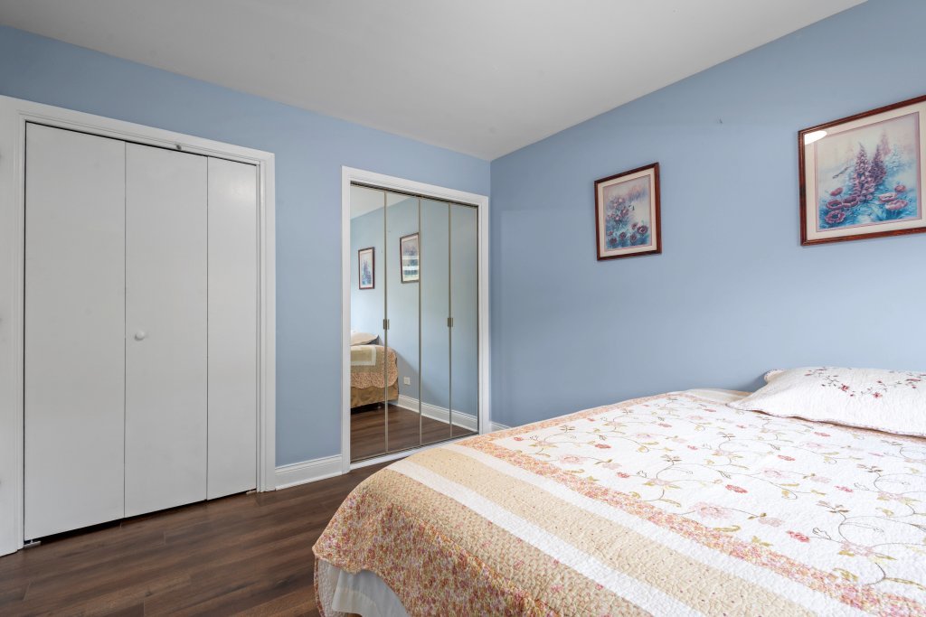 2004 East Parkview Circle Hoffman Estates, IL 60169 - Photo 22 of 36 a bedroom with a bed and wooden floor