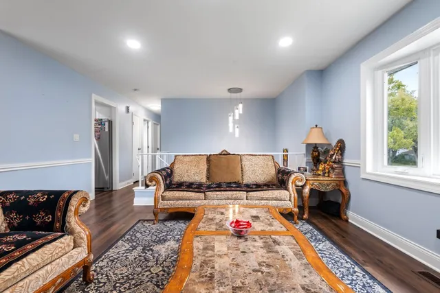 a bed room with furniture and a window