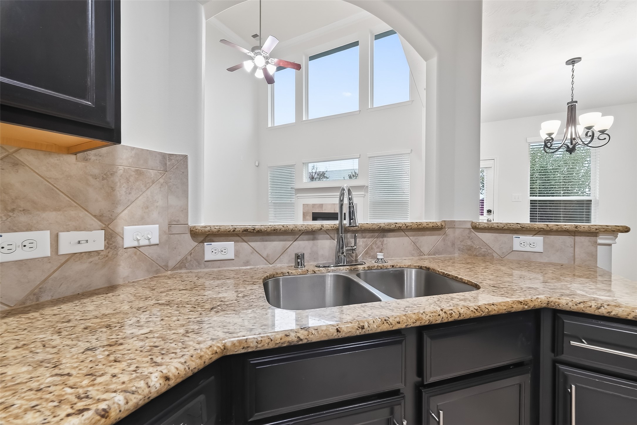 25018 Clover Ranch Drive Katy, TX 77494 - Photo 15 of 45 a kitchen with granite countertop a sink a counter top space and cabinets