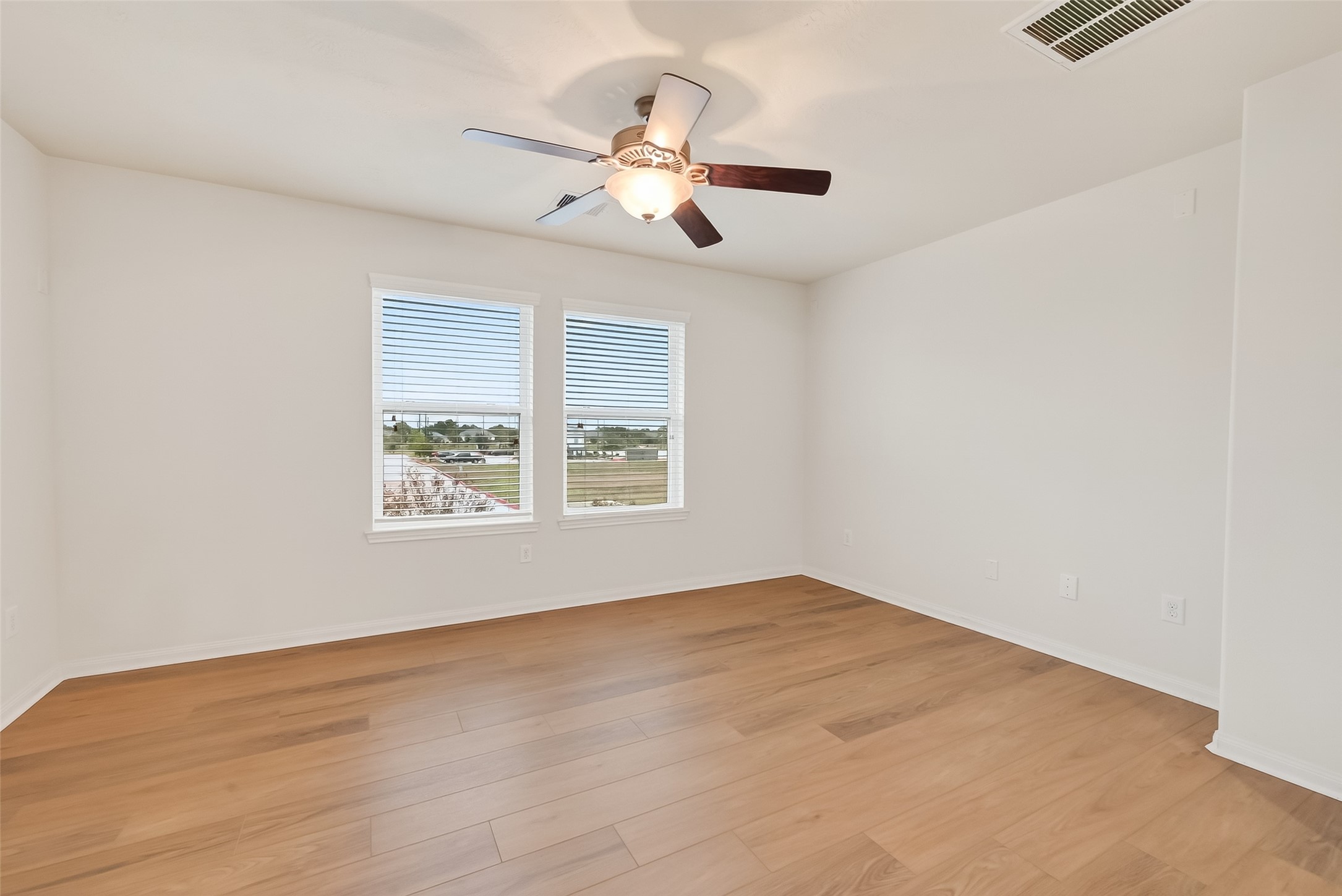 25018 Clover Ranch Drive Katy, TX 77494 - Photo 19 of 45 wooden floor in an empty room with a window