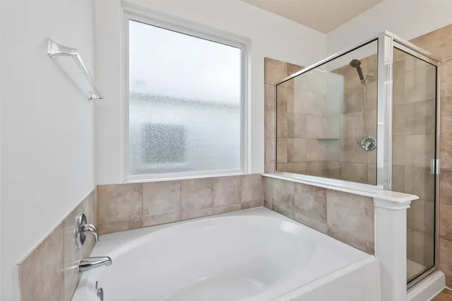 a bath tub sitting next to a window