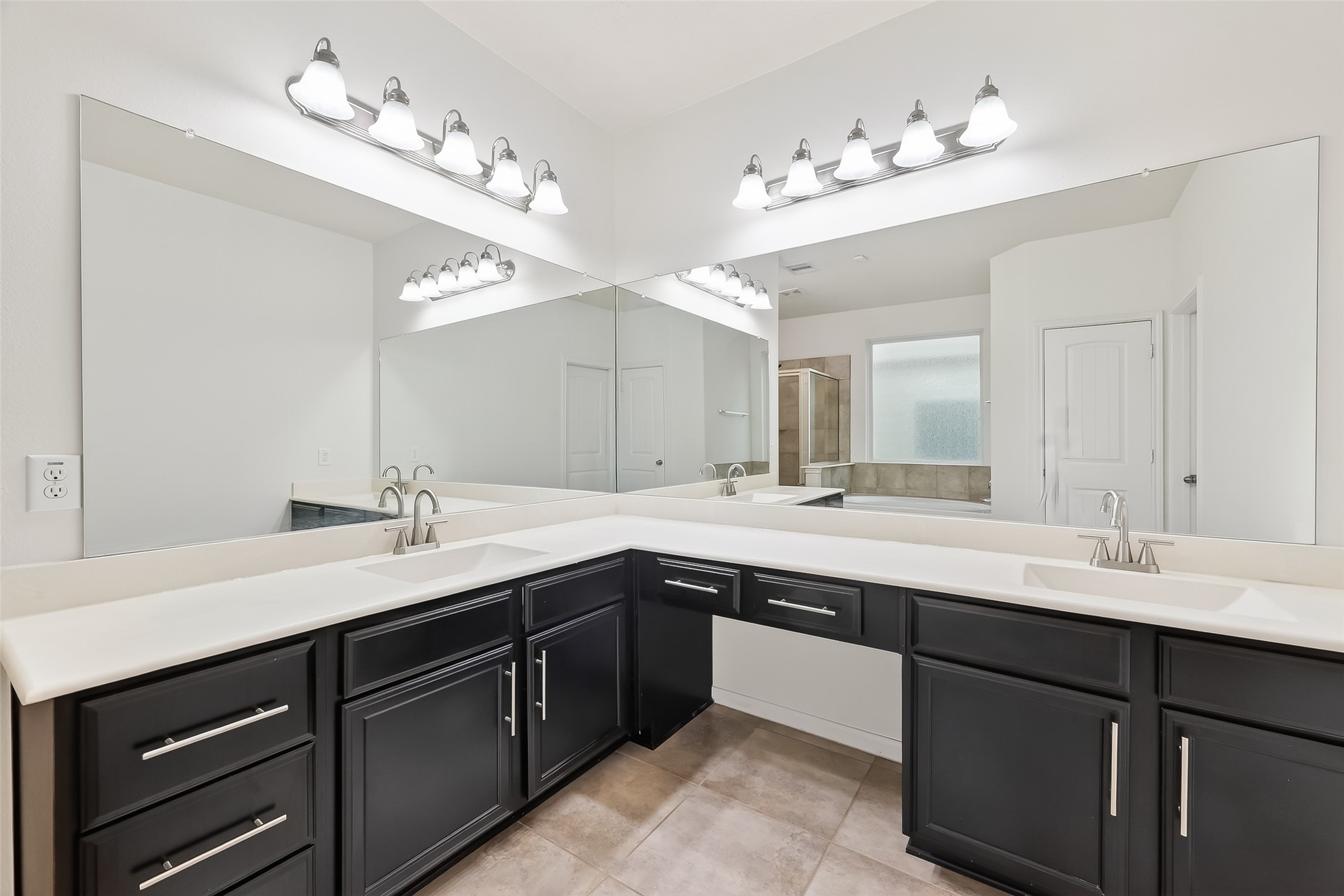 25018 Clover Ranch Drive Katy, TX 77494 - Photo 23 of 45 a spacious bathroom with a double vanity sink and a mirror