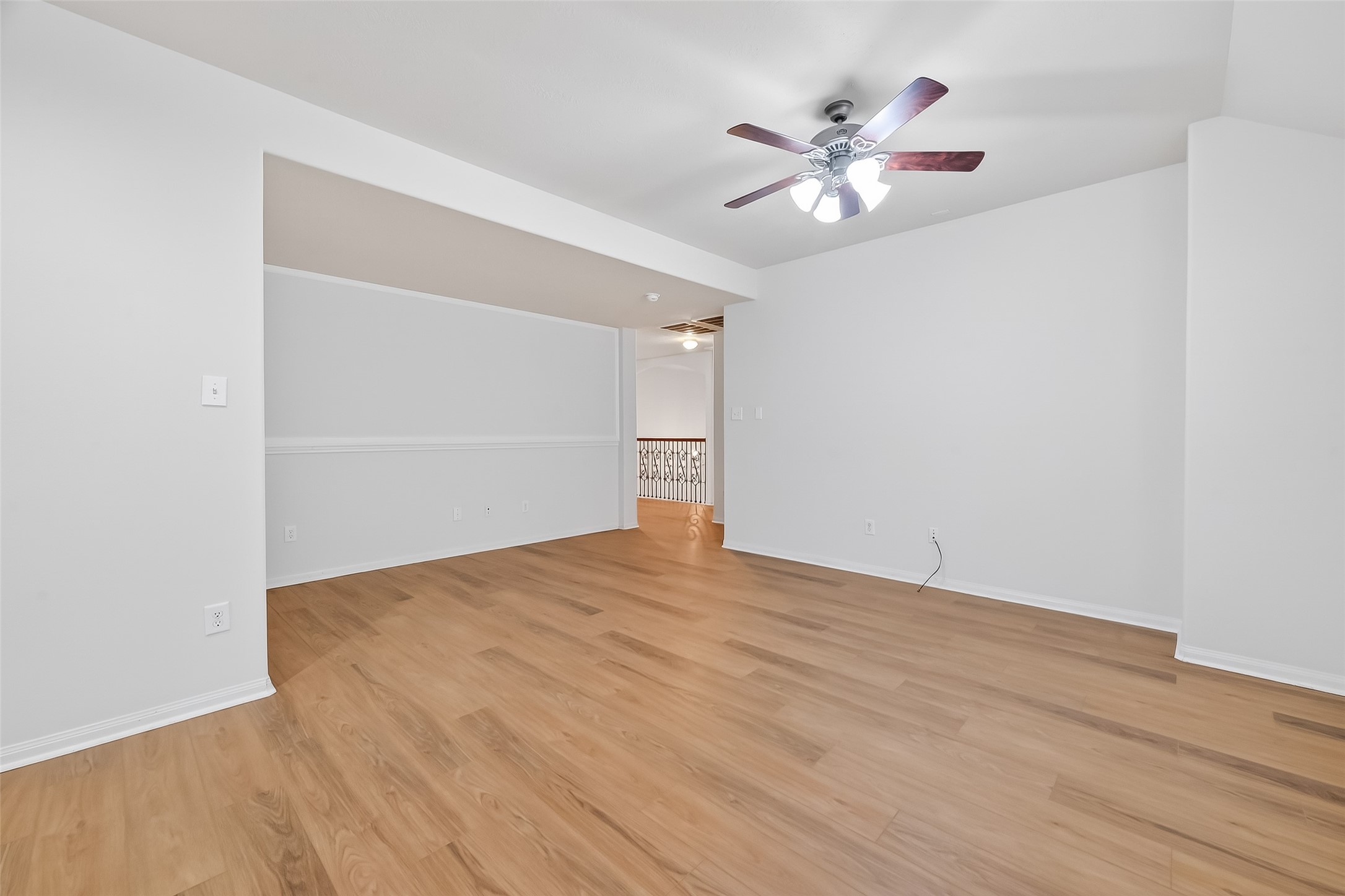 25018 Clover Ranch Drive Katy, TX 77494 - Photo 26 of 45 a view of an empty room with wooden floor