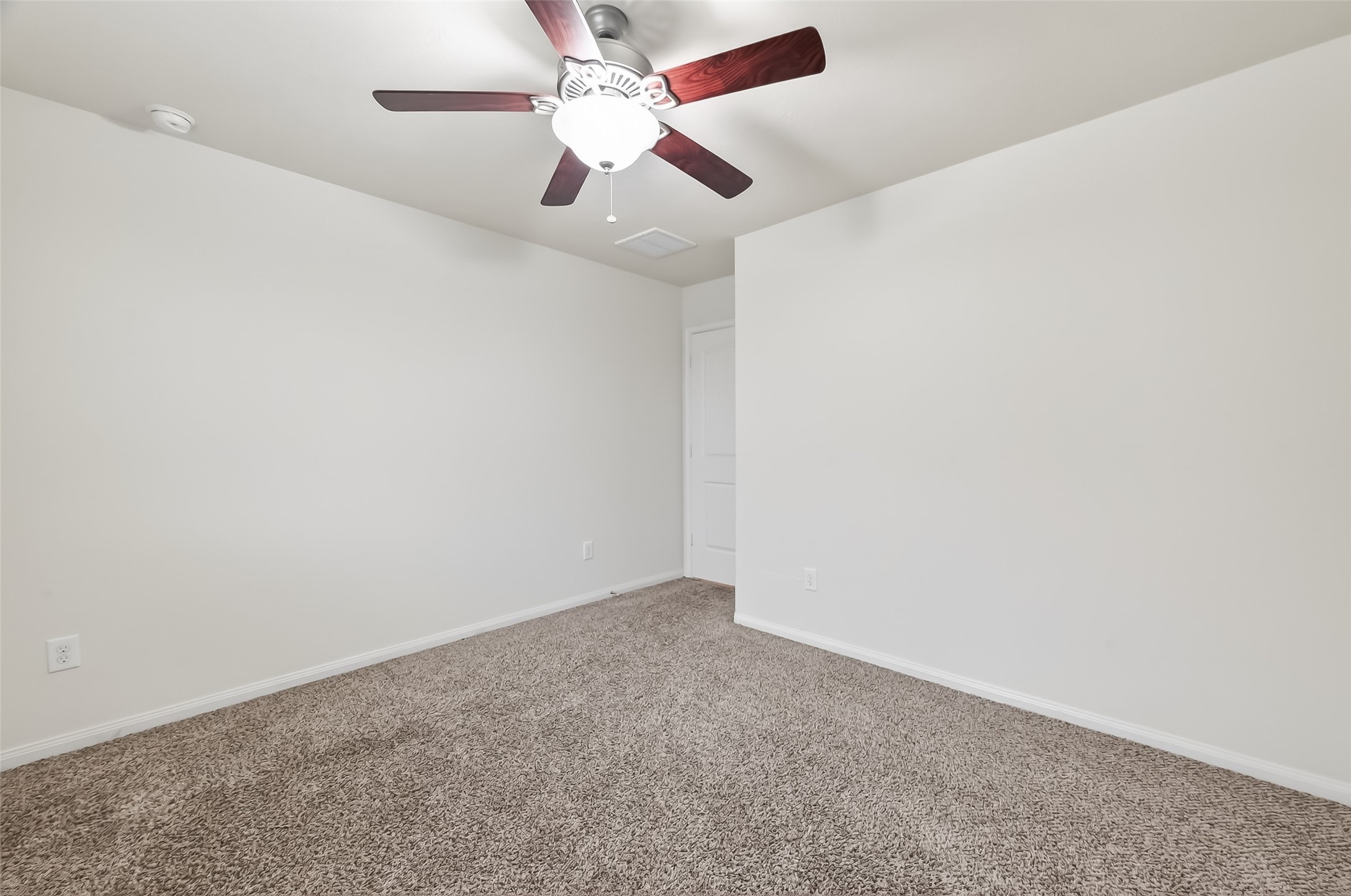 25018 Clover Ranch Drive Katy, TX 77494 - Photo 30 of 45 an empty room with a window and a fan
