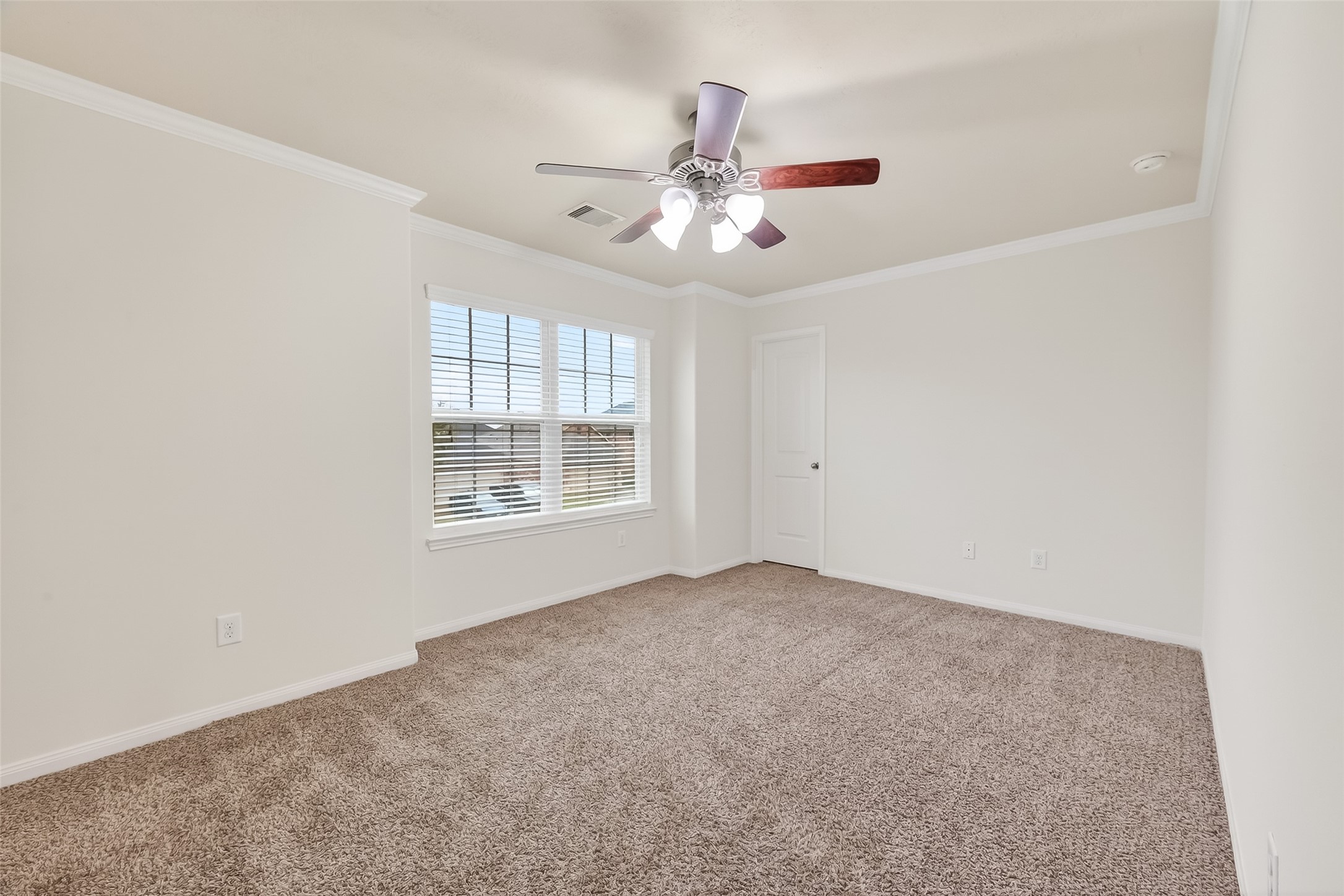 25018 Clover Ranch Drive Katy, TX 77494 - Photo 31 of 45 an empty room with windows and fan