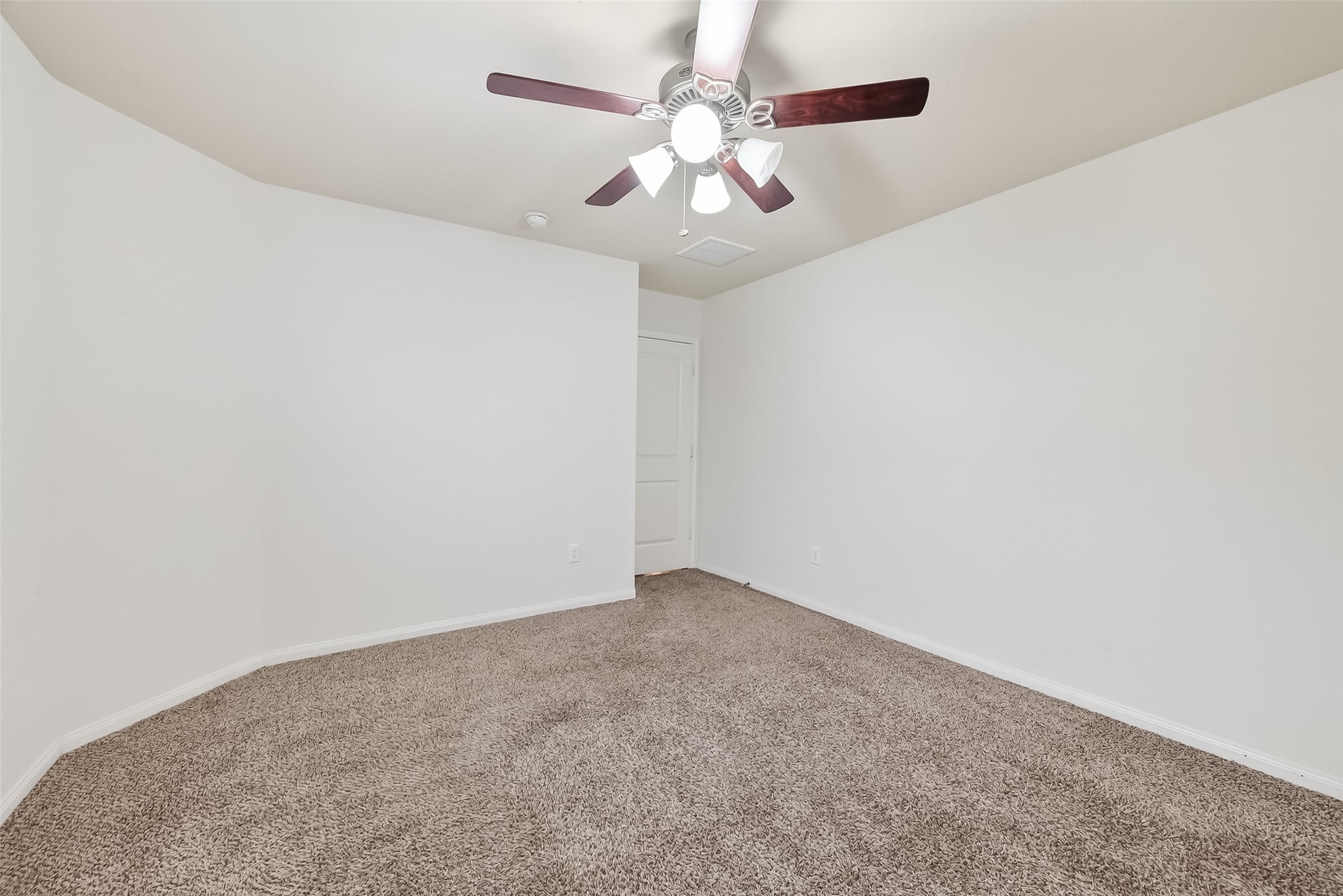 25018 Clover Ranch Drive Katy, TX 77494 - Photo 37 of 45 an empty room with a chandelier fan and closet