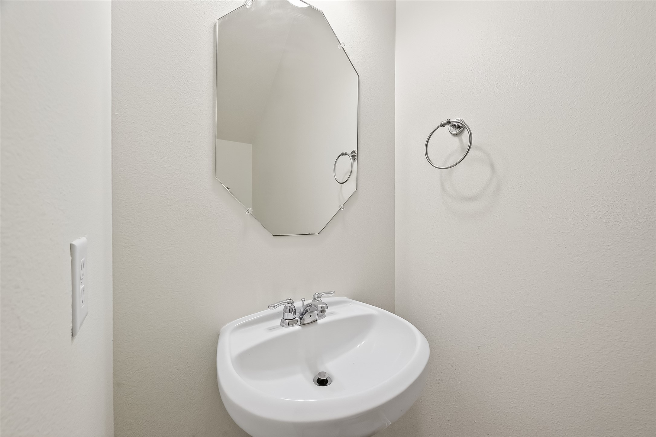 25018 Clover Ranch Drive Katy, TX 77494 - Photo 38 of 45 a bathroom with a sink and mirror