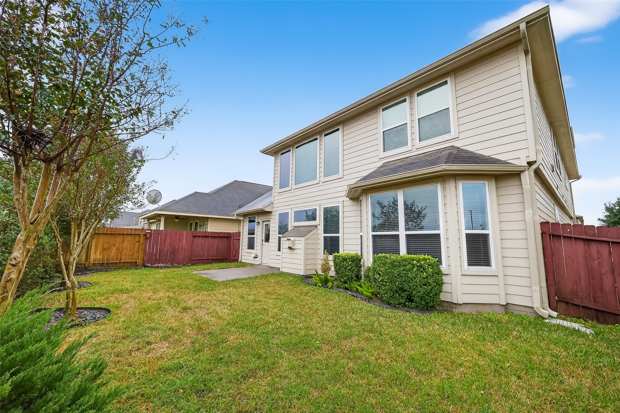 25018 Clover Ranch Drive Katy, TX 77494 - Photo 42 of 45 a view of a house with a yard potted plants and a table