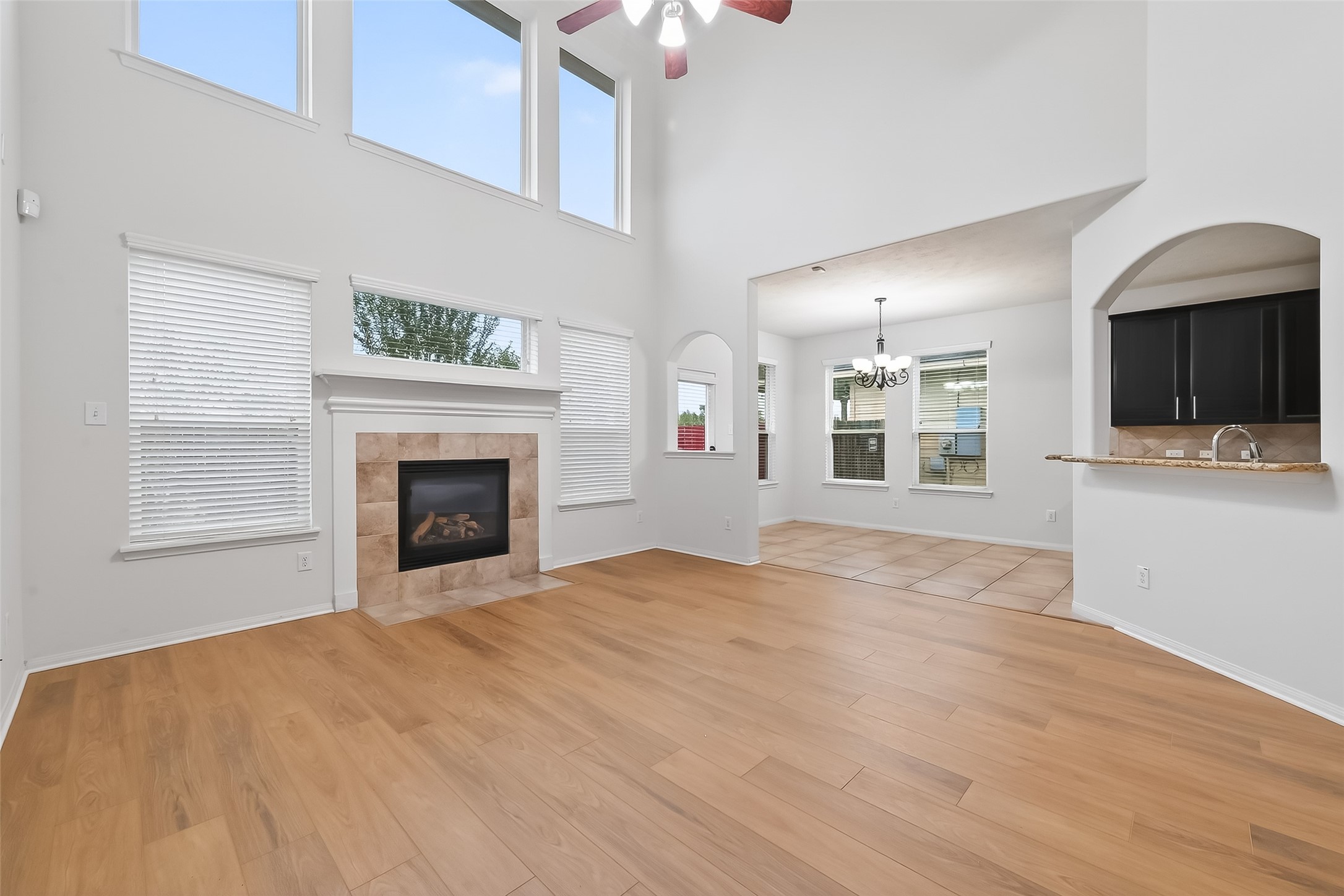 25018 Clover Ranch Drive Katy, TX 77494 - Photo 7 of 45 a view of empty room with kitchen and fireplace