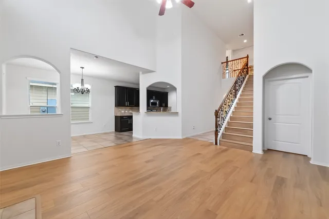 a view of an empty room with stairs