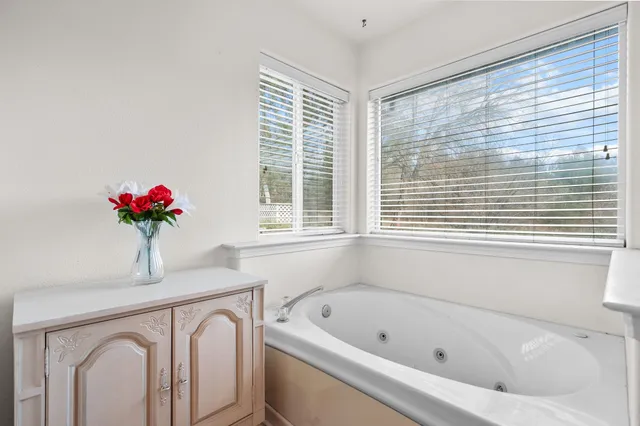 a bedroom with bed and a window