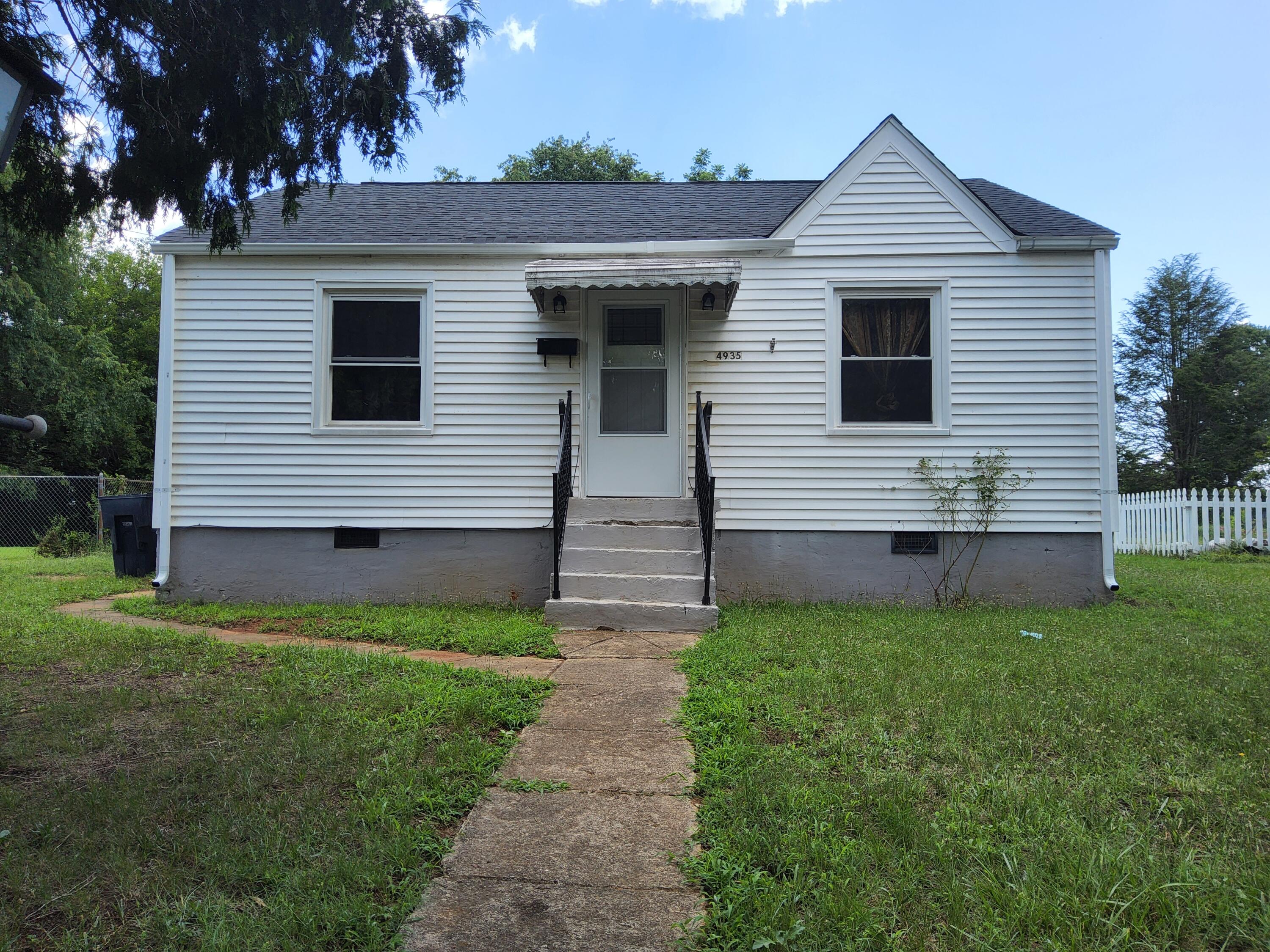 4935 Fralin Road Northwest Roanoke, VA 24012 - Photo 1 of 16 a view of a house with a yard