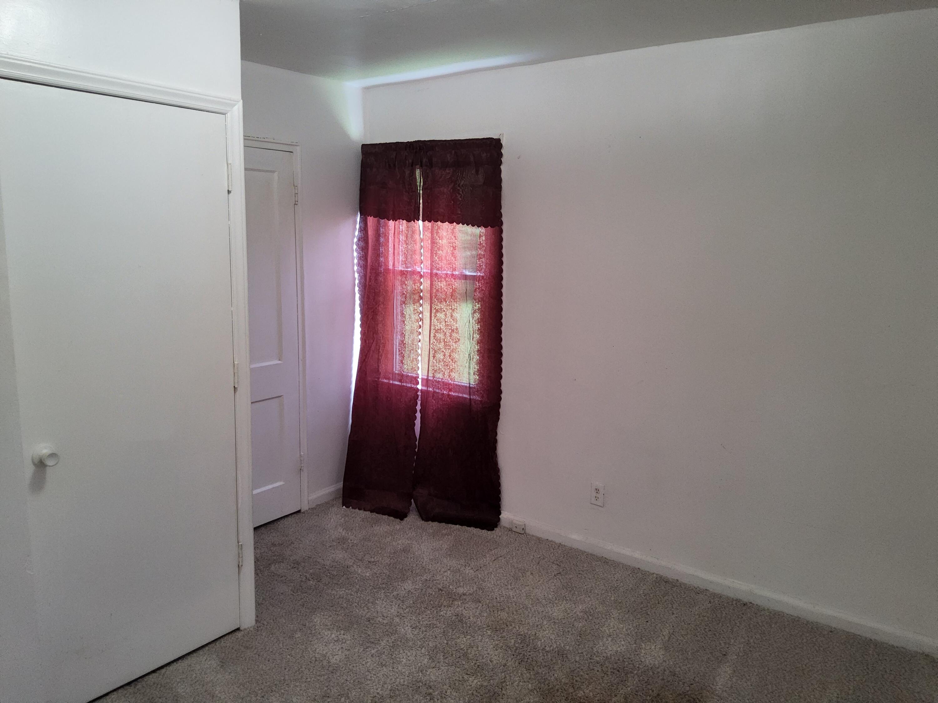 4935 Fralin Road Northwest Roanoke, VA 24012 - Photo 14 of 16 an empty room with an entryway and window