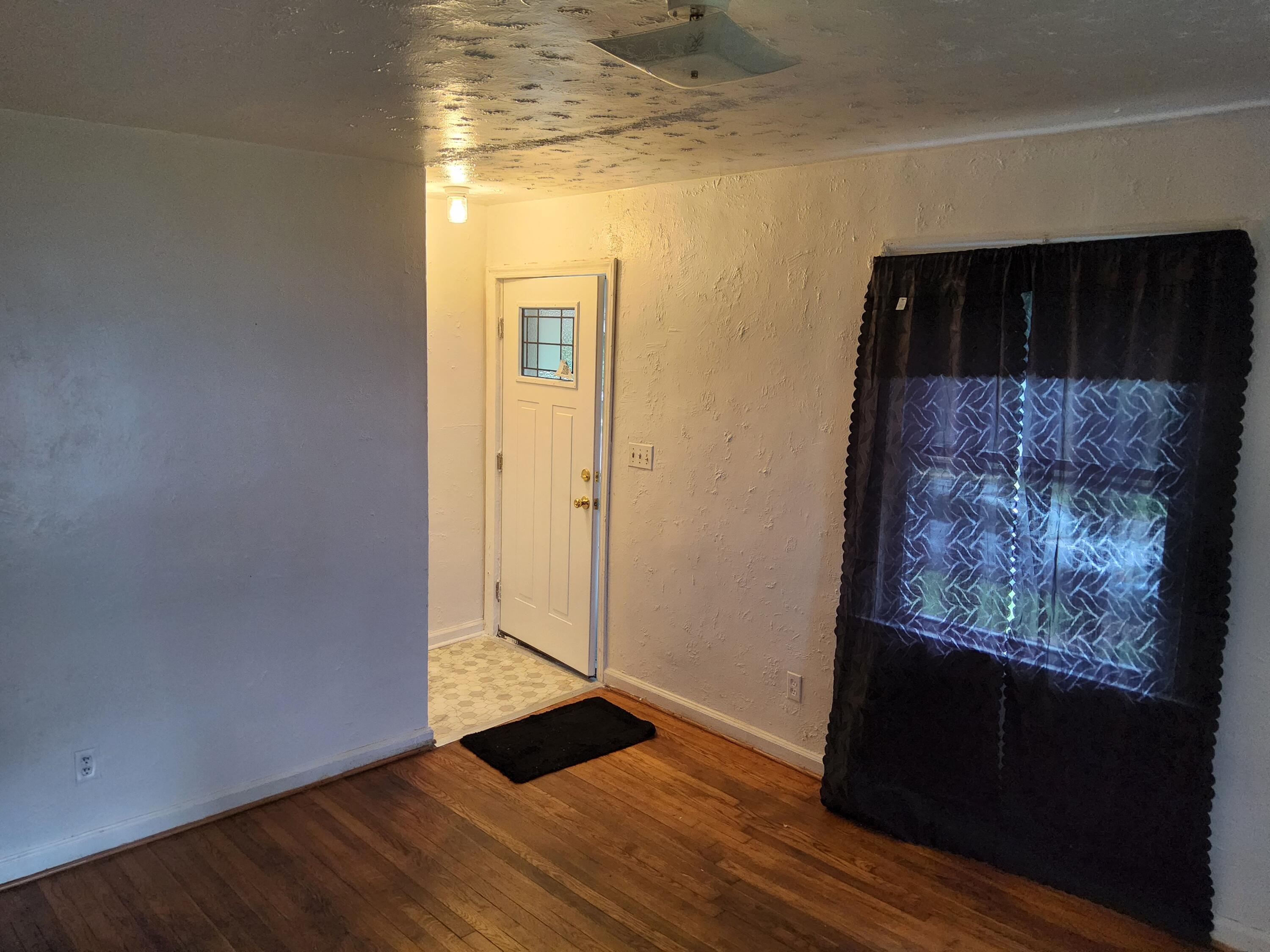 4935 Fralin Road Northwest Roanoke, VA 24012 - Photo 5 of 16 a view of a hallway with wooden floor