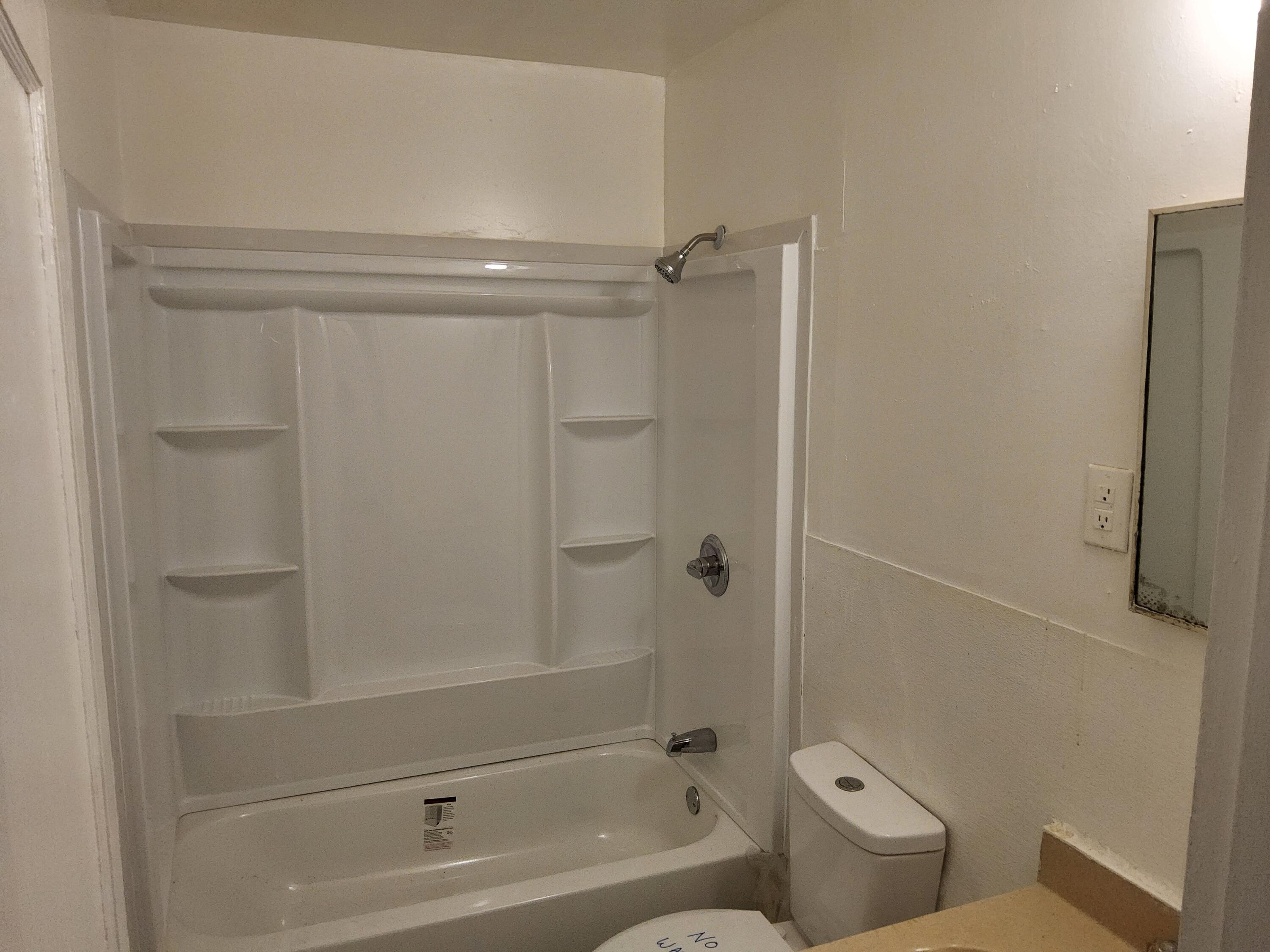 4935 Fralin Road Northwest Roanoke, VA 24012 - Photo 6 of 16 a bathroom with a bathtub and a shower