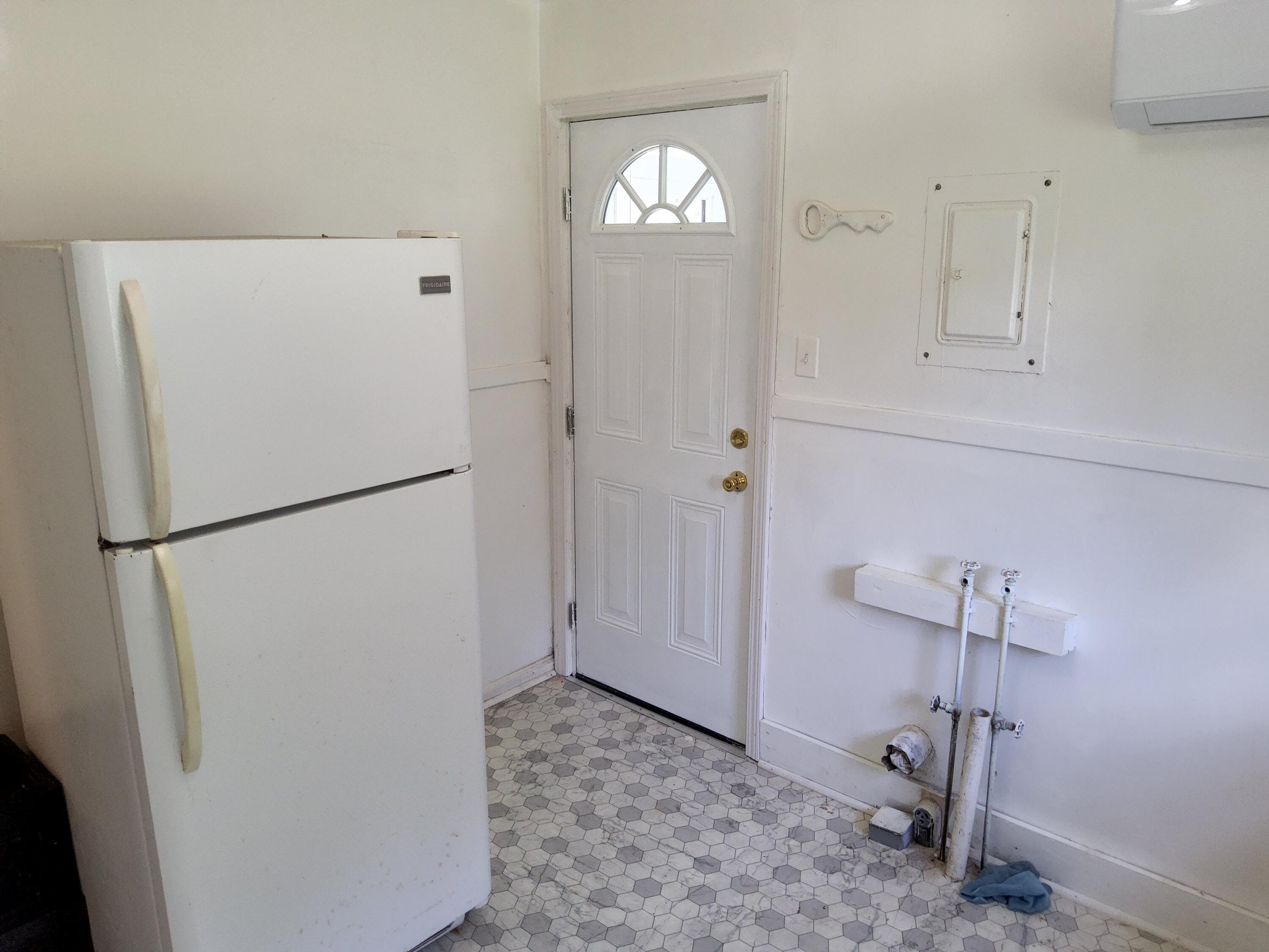 4935 Fralin Road Northwest Roanoke, VA 24012 - Photo 8 of 16 a view of a kitchen with refrigerator and window