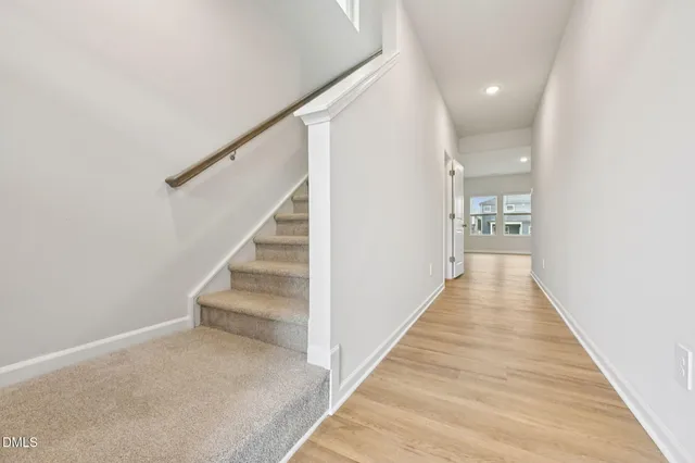 a view of a hallway with stairs