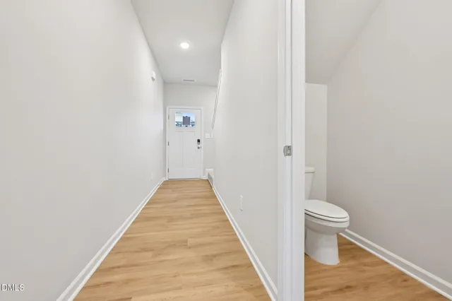 a view of a bathroom from the hallway