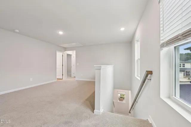 a view of an empty room with stairs