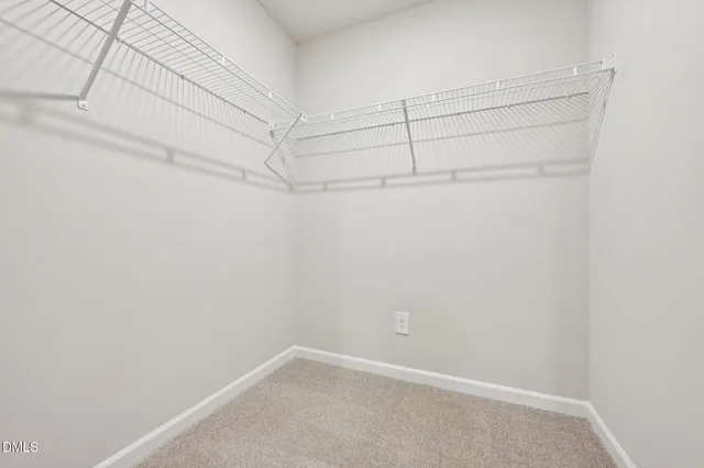 a view of a room with racks on the wall