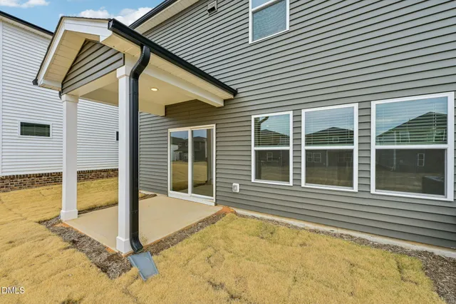 a view of a house with large windows