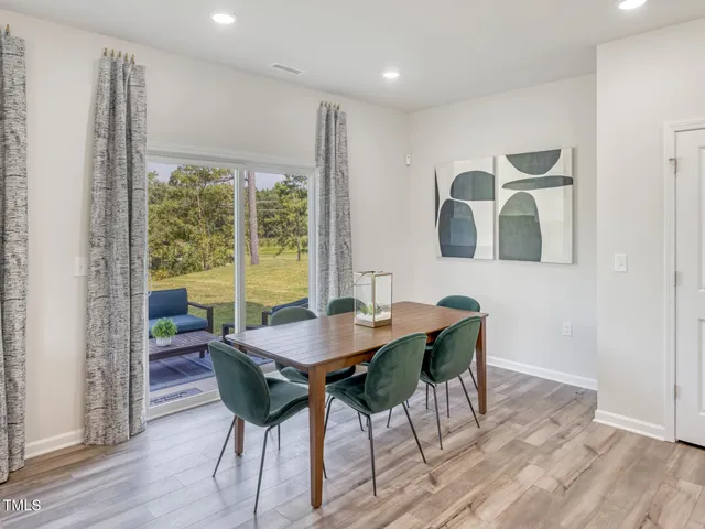 a kitchen with a refrigerator a stove top oven and kitchen island