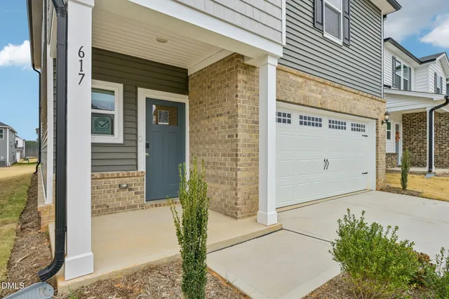 a front view of a house with a garage