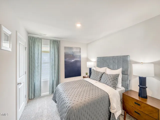 a view of a workspace with furniture and window