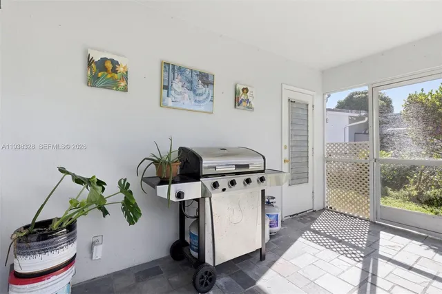 a view of a storage and utility room with a window