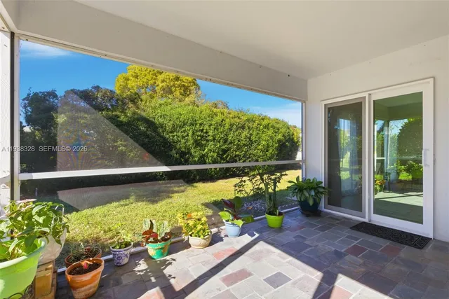 a view of a porch with a potted plant