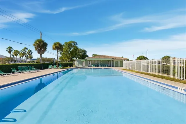 a view of a swimming pool and an outdoor seating