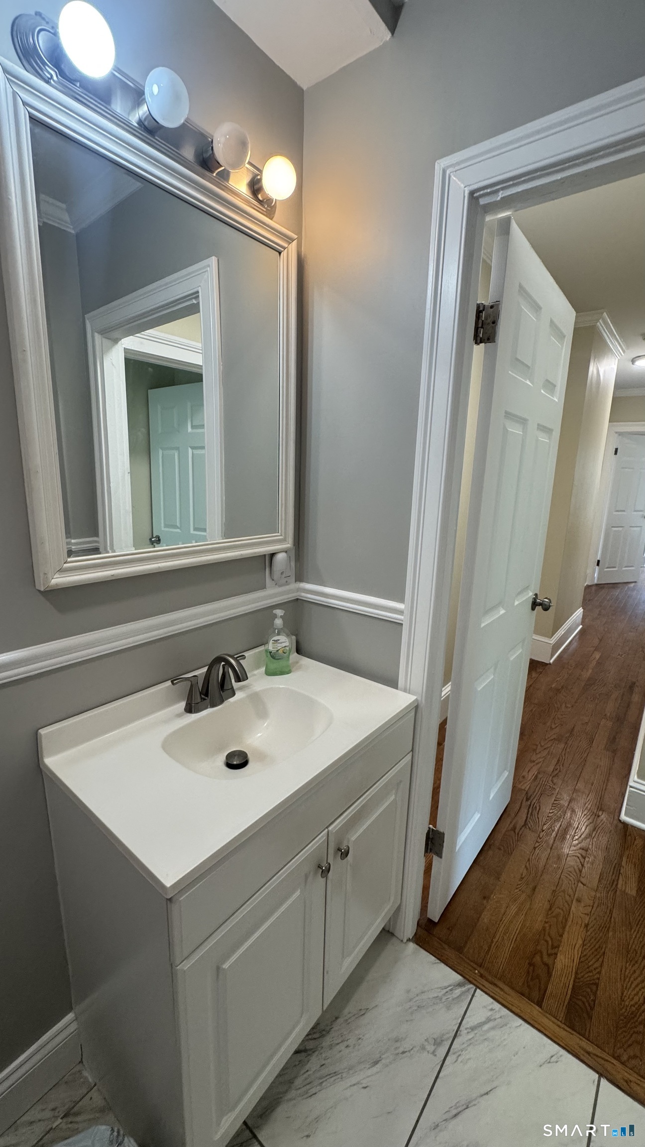 104 Prospect Street Ansonia, CT 06401 - Photo 21 of 40 a bathroom with a sink vanity and a mirror