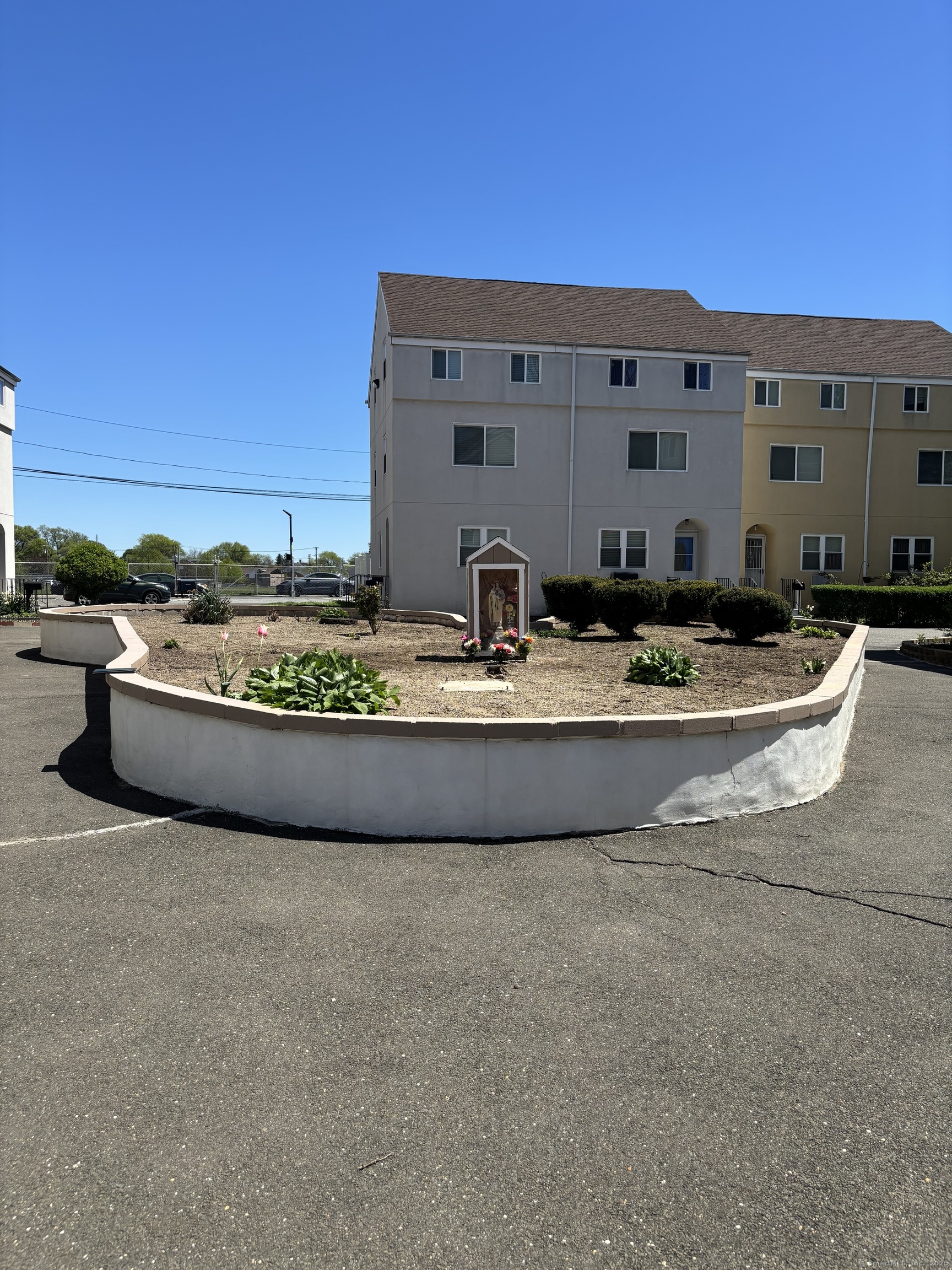 60 Gilmore Street, Unit 21 Bridgeport, CT 06608 - Photo 13 of 13 a view of swimming pool with outdoor seating and house in the background