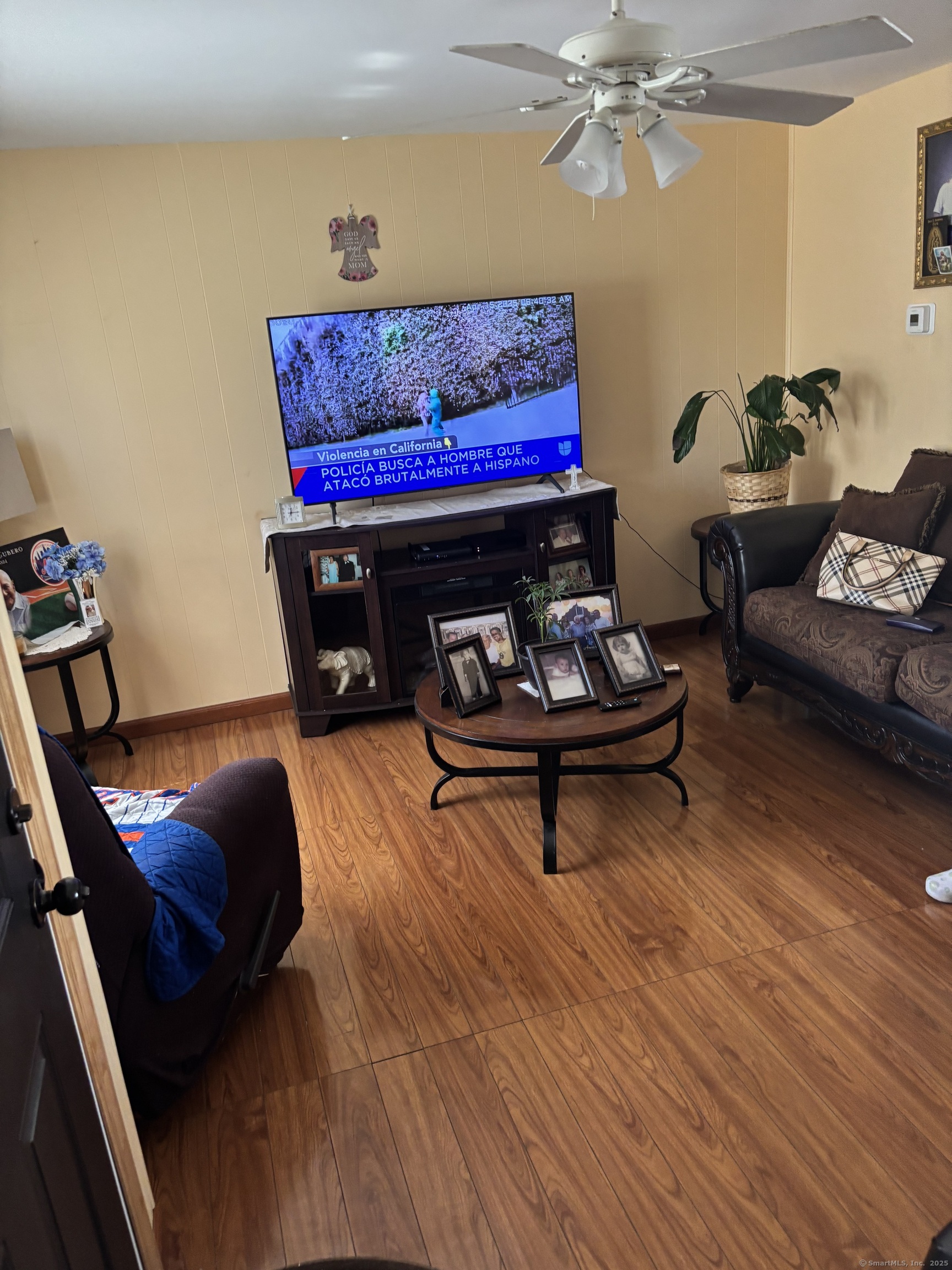 60 Gilmore Street, Unit 21 Bridgeport, CT 06608 - Photo 2 of 13 a living room with furniture and a fireplace